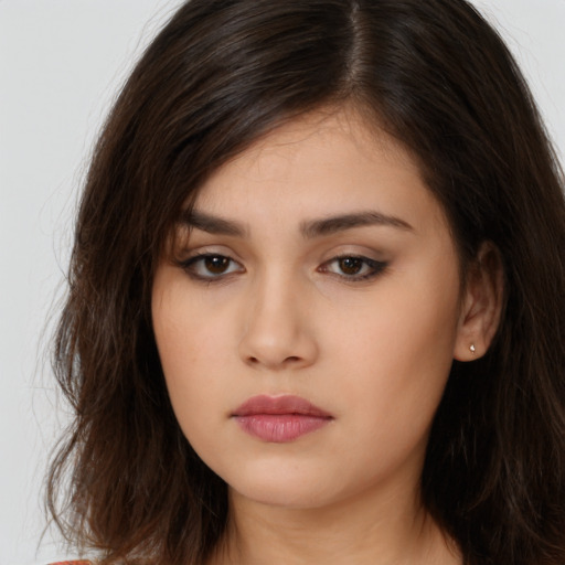 Neutral white young-adult female with long  brown hair and brown eyes