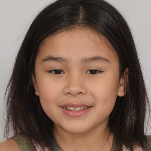Joyful asian child female with medium  brown hair and brown eyes