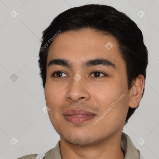 Joyful latino young-adult male with short  black hair and brown eyes