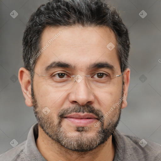 Joyful white adult male with short  black hair and brown eyes