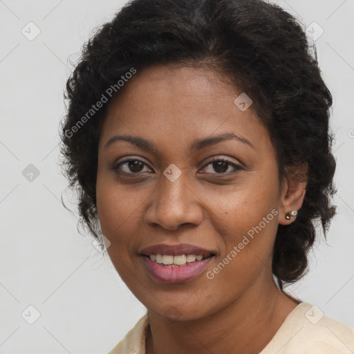 Joyful black young-adult female with long  brown hair and brown eyes