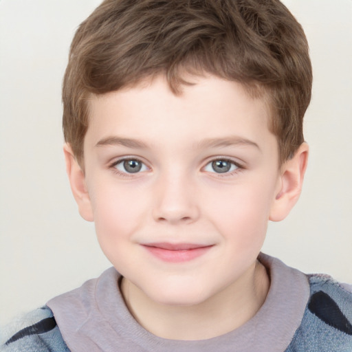 Joyful white child male with short  brown hair and grey eyes