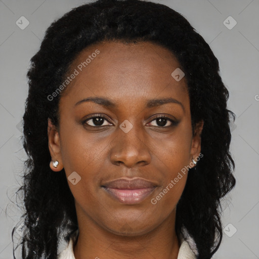 Joyful black young-adult female with long  black hair and brown eyes