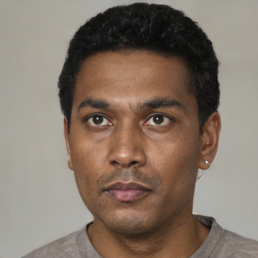 Neutral black young-adult male with short  black hair and brown eyes