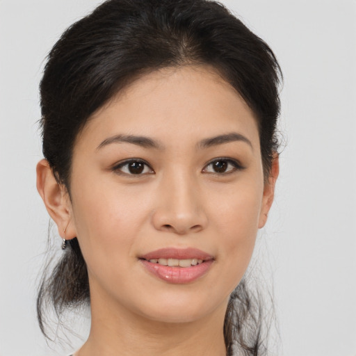 Joyful asian young-adult female with medium  brown hair and brown eyes