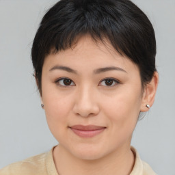 Joyful asian young-adult female with short  brown hair and brown eyes