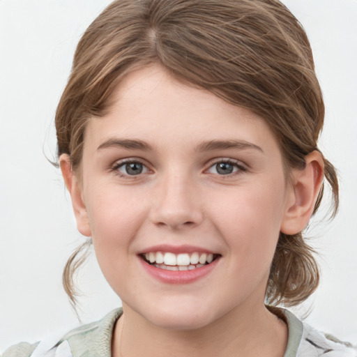 Joyful white child female with medium  brown hair and grey eyes