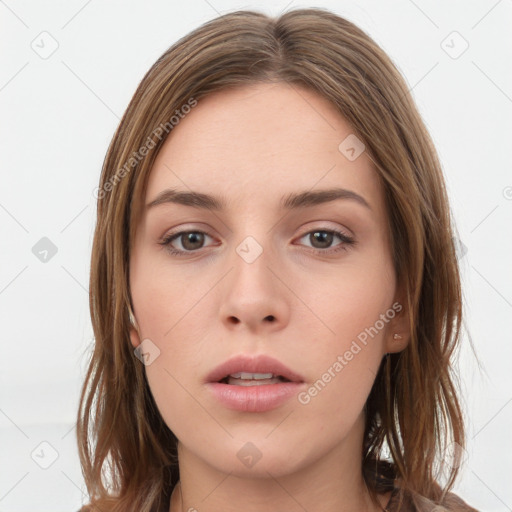 Neutral white young-adult female with long  brown hair and brown eyes