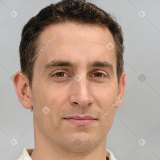 Joyful white adult male with short  brown hair and brown eyes