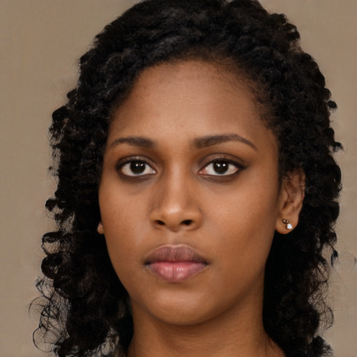 Neutral black young-adult female with long  black hair and brown eyes