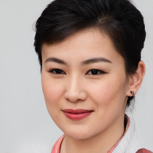 Joyful asian young-adult female with medium  brown hair and brown eyes