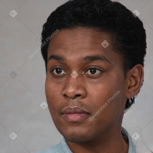 Neutral black young-adult male with short  black hair and brown eyes