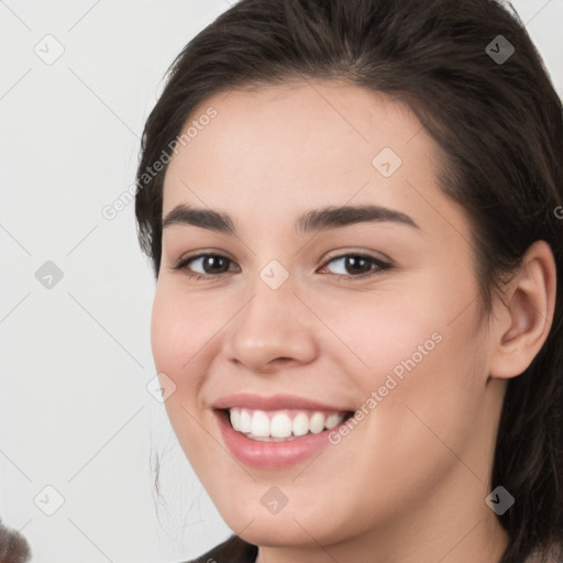 Joyful white young-adult female with medium  brown hair and brown eyes