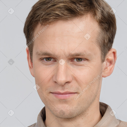 Joyful white adult male with short  brown hair and grey eyes