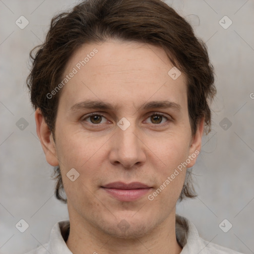 Joyful white adult male with short  brown hair and grey eyes