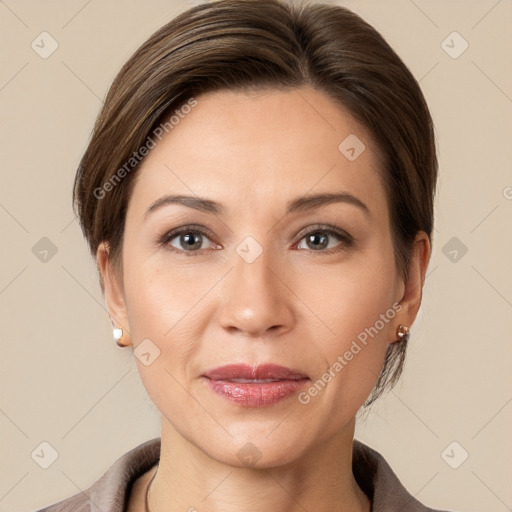 Joyful white adult female with short  brown hair and brown eyes