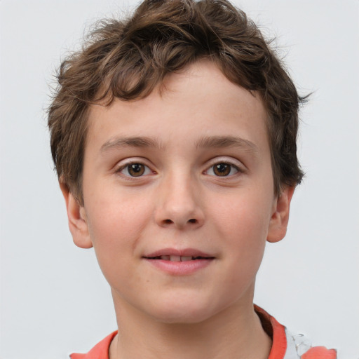 Joyful white child male with short  brown hair and grey eyes