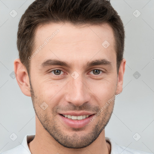 Joyful white young-adult male with short  brown hair and brown eyes