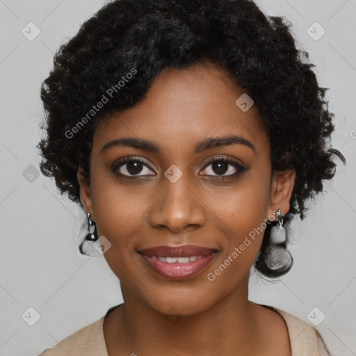 Joyful black young-adult female with long  black hair and brown eyes