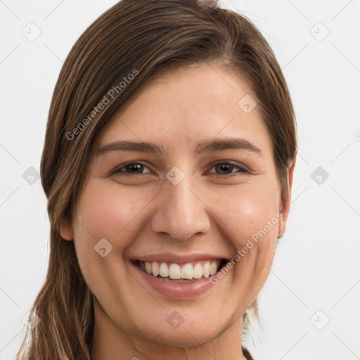 Joyful white young-adult female with long  brown hair and grey eyes