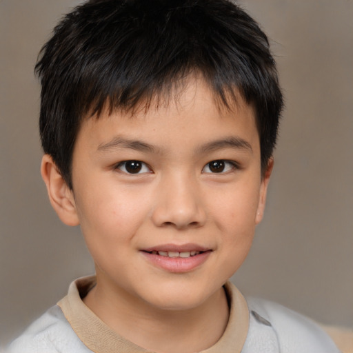 Joyful white child male with short  brown hair and brown eyes