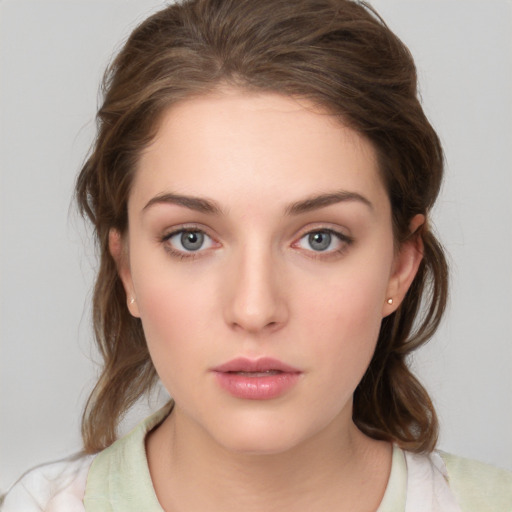 Neutral white young-adult female with medium  brown hair and grey eyes