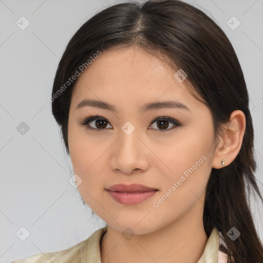 Joyful latino young-adult female with medium  brown hair and brown eyes