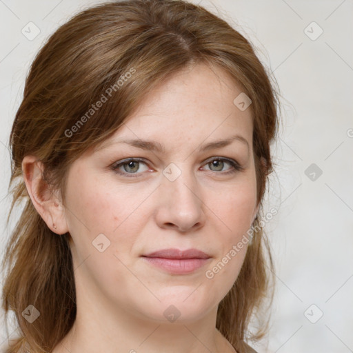 Joyful white young-adult female with long  brown hair and blue eyes