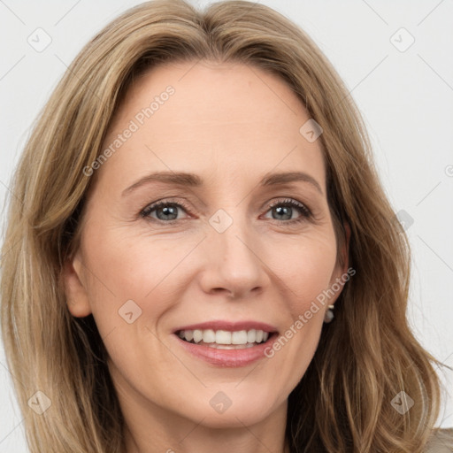 Joyful white adult female with long  brown hair and brown eyes