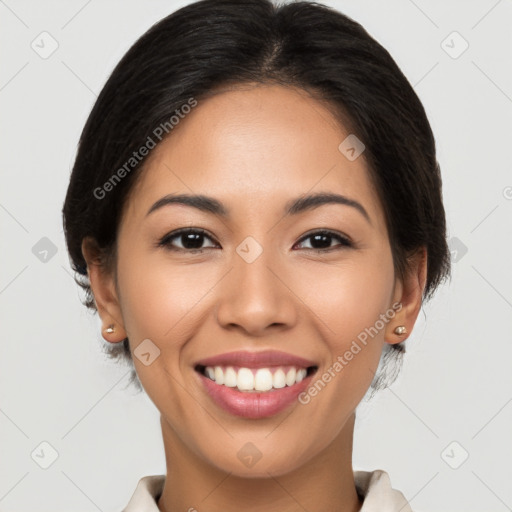 Joyful latino young-adult female with short  brown hair and brown eyes