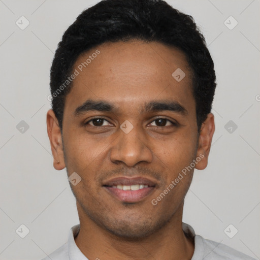 Joyful black young-adult male with short  black hair and brown eyes