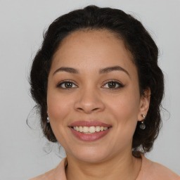 Joyful latino young-adult female with medium  brown hair and brown eyes