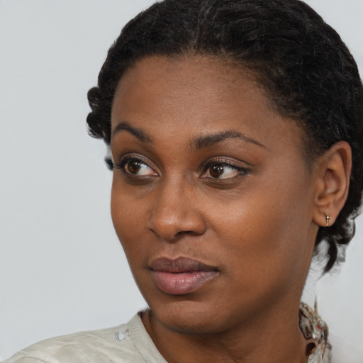 Neutral black young-adult female with short  black hair and brown eyes