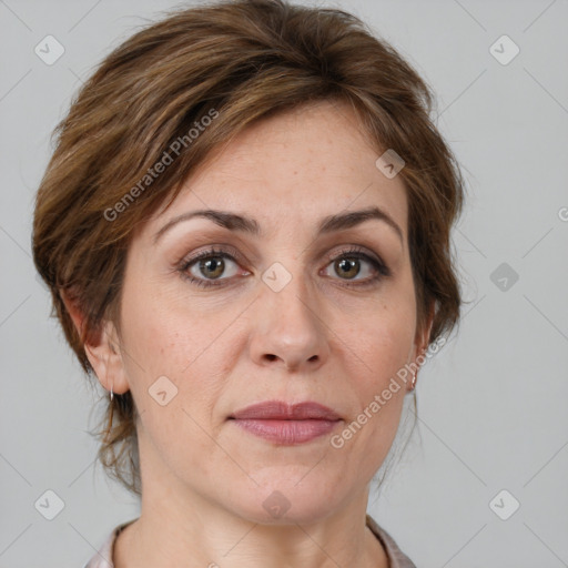 Joyful white adult female with medium  brown hair and grey eyes