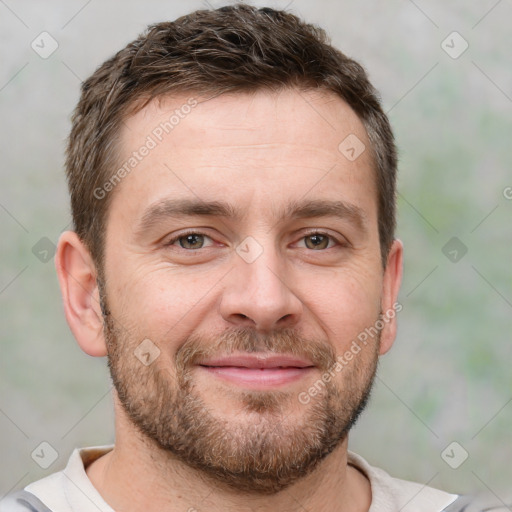 Joyful white adult male with short  brown hair and brown eyes