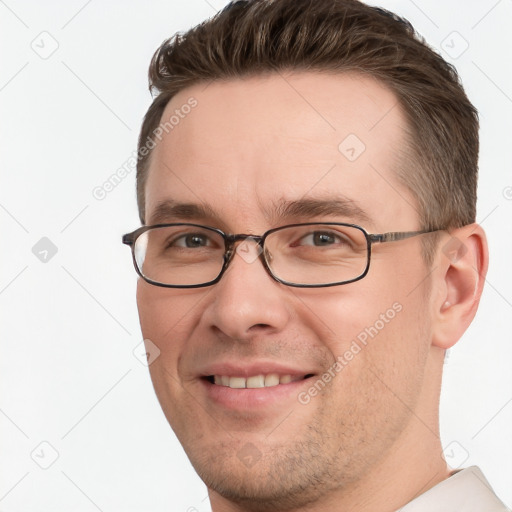 Joyful white young-adult male with short  brown hair and grey eyes