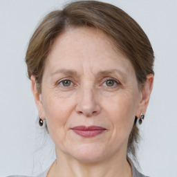 Joyful white adult female with medium  brown hair and grey eyes