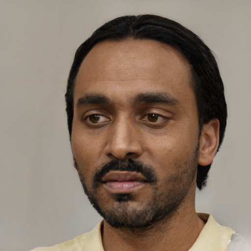 Neutral black young-adult male with short  black hair and brown eyes