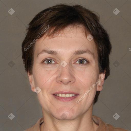 Joyful white adult female with short  brown hair and grey eyes