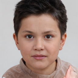 Joyful white child male with short  brown hair and brown eyes