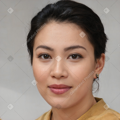 Joyful asian young-adult female with medium  brown hair and brown eyes