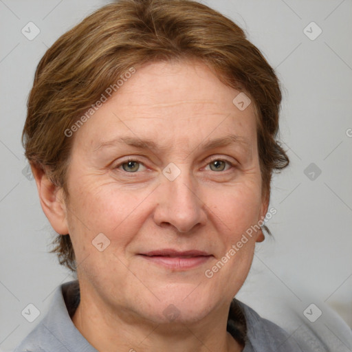 Joyful white adult female with medium  brown hair and blue eyes