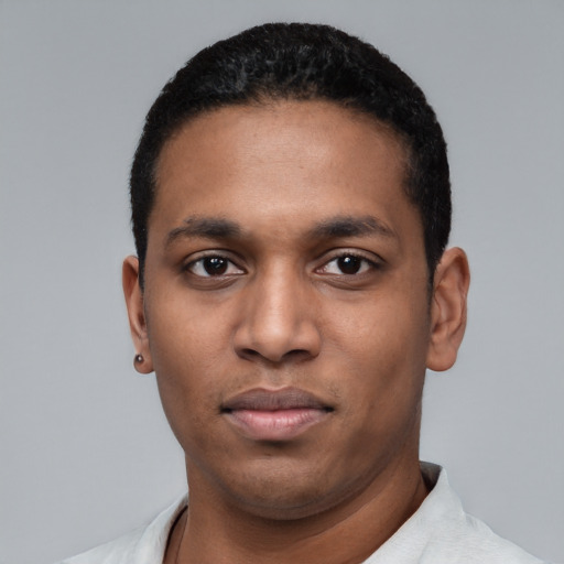 Neutral latino young-adult male with short  black hair and brown eyes