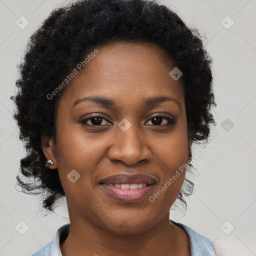 Joyful black young-adult female with long  brown hair and brown eyes