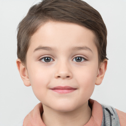 Joyful white child male with short  brown hair and brown eyes