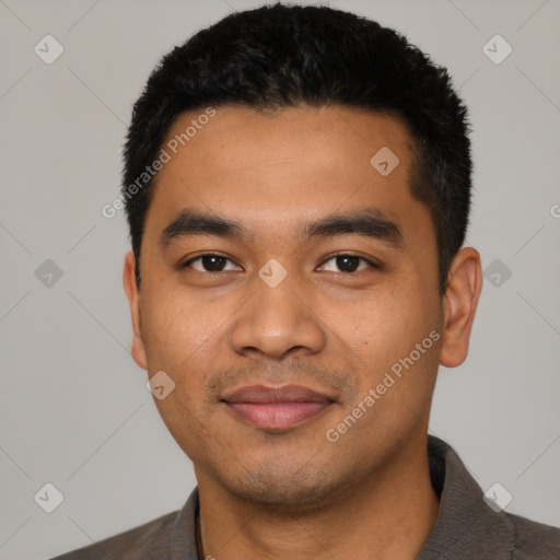 Joyful latino young-adult male with short  black hair and brown eyes