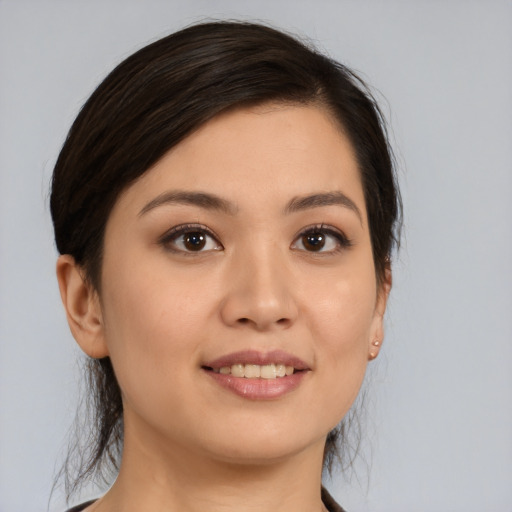 Joyful white young-adult female with medium  brown hair and brown eyes