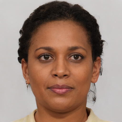 Neutral black young-adult female with short  brown hair and brown eyes
