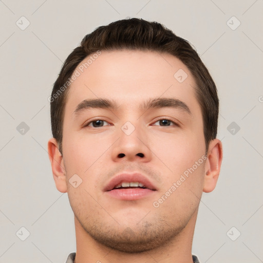 Neutral white young-adult male with short  brown hair and brown eyes