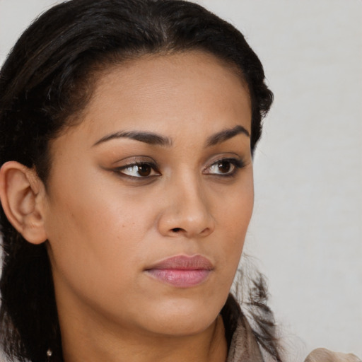 Neutral latino young-adult female with long  brown hair and brown eyes